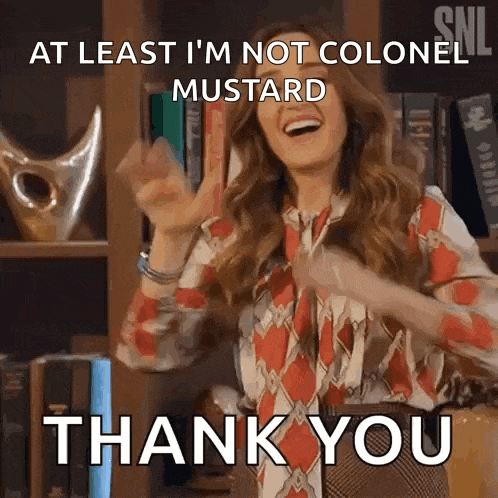 a woman is dancing in front of a bookshelf and saying at least i 'm not colonel mustard .