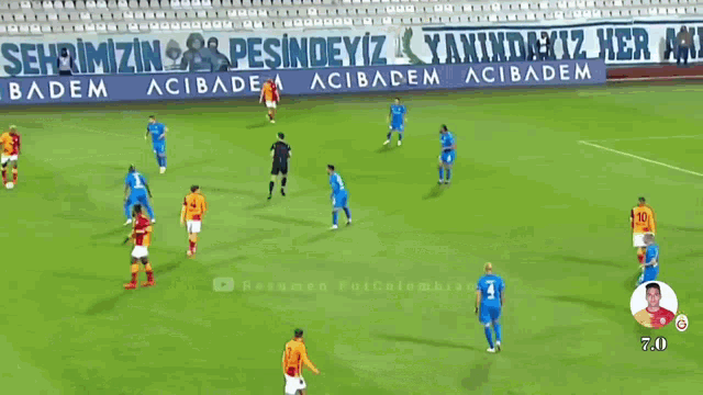 a soccer game is being played in front of a banner that says palandoken kartallari