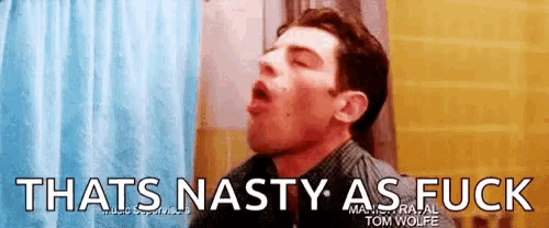 a man is making a funny face in a bathroom with the words `` that 's nasty as fuck '' .