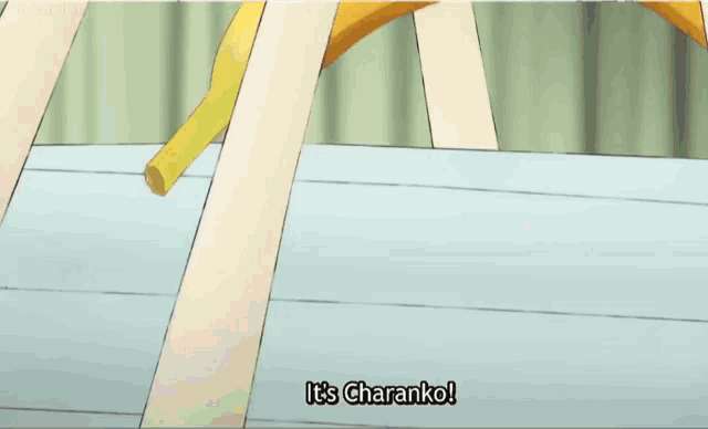 a bald man wearing an oppai shirt is holding bananas