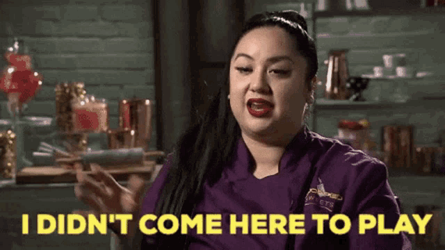 a woman in a purple chef 's coat says " i didn 't come here to play "