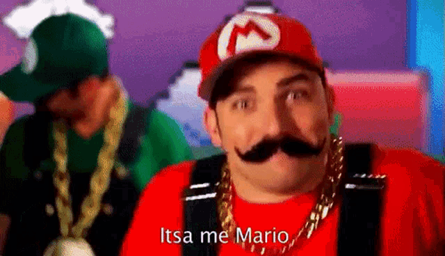 a man in a mario costume is wearing a hat and a chain .