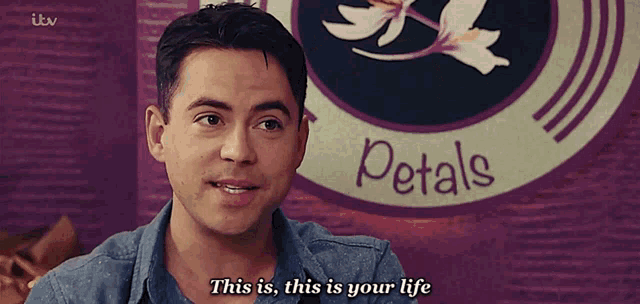 a man says this is this is your life in front of a sign for petals