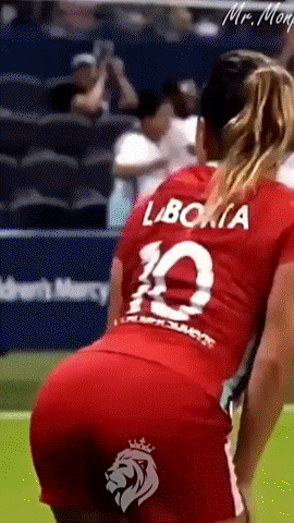 a woman in a red jersey with the number 10 on the back