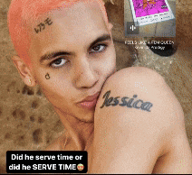a man with pink hair has a tattoo of jessica on his shoulder