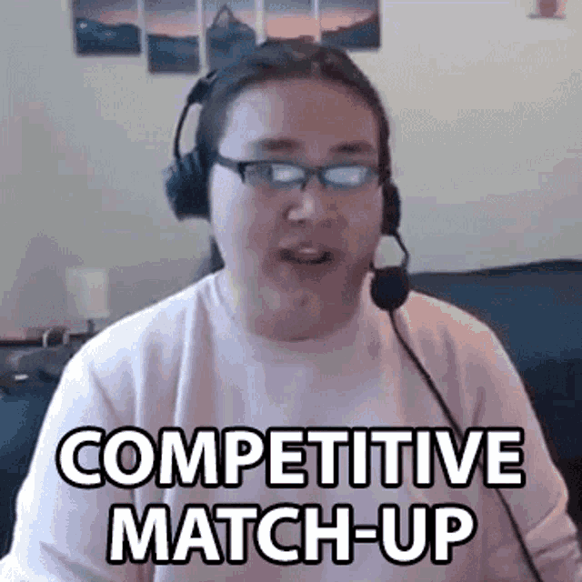 a man wearing headphones and glasses is talking into a microphone and says `` competitive match-up '' .