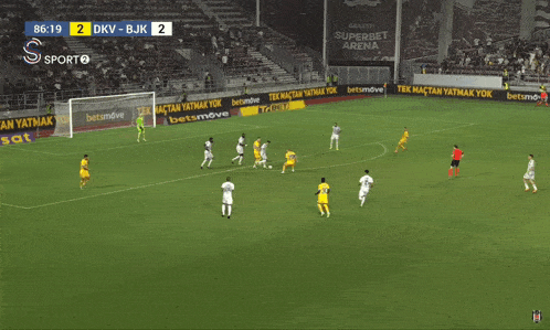 a soccer game between dkv and bjk is being played