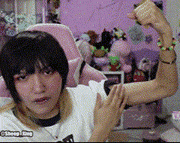 a girl is flexing her arm in front of a purple background