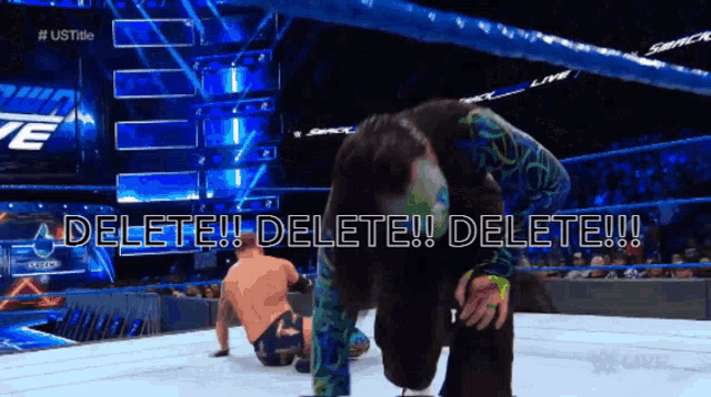 a wrestling match with the words delete written on the bottom