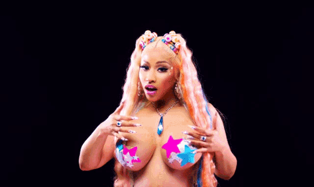 a naked woman with colorful hair and stars on her breast