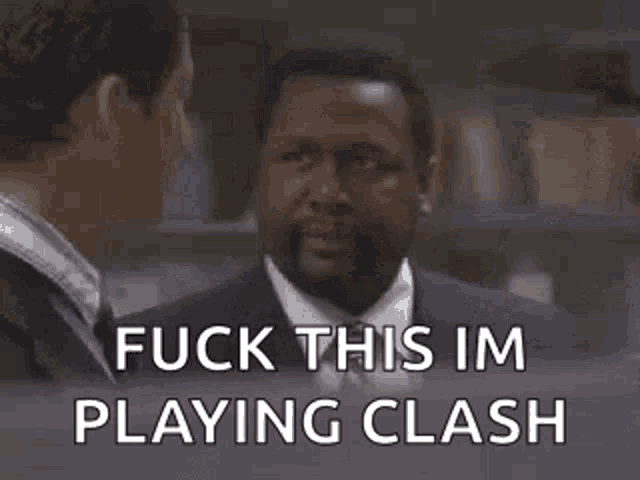 a man in a suit and tie is talking to another man in an office and saying `` fuck this im playing clash '' .