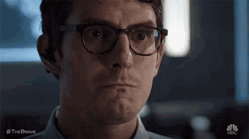 a close up of a man wearing glasses and a headset with the brave written on the bottom