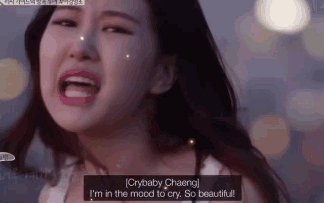 a close up of a woman crying with a caption that says crybaby chaeng i 'm in the mood to cry so beautiful