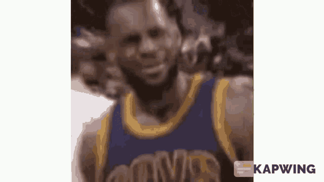a close up of a basketball player wearing a blue and gold uniform .