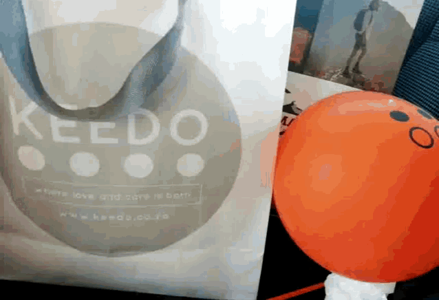 a keedo bag sits next to a balloon