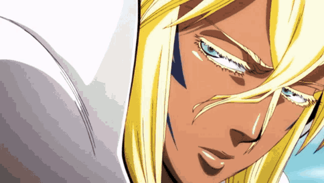 a close up of a person 's face with blonde hair