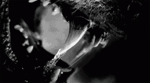 a close up of a person 's mouth with a long tongue sticking out .