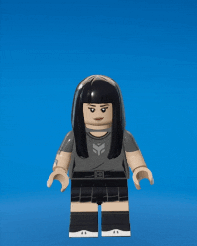 a lego girl with long black hair is wearing a grey shirt and black shorts
