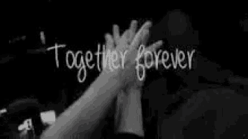 a black and white photo of two people giving each other a high five with the words `` together forever '' written above them .