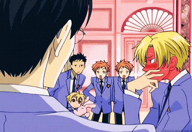 a group of anime characters are standing in front of a fan and one of them has a red face