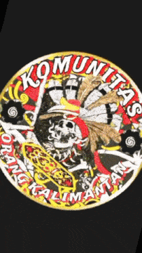 a sticker with a skull and the word komunitas on it