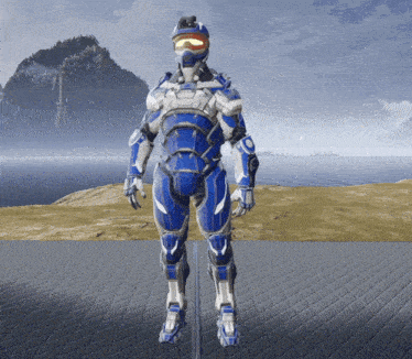a blue and white robot with a helmet and goggles stands in front of a body of water