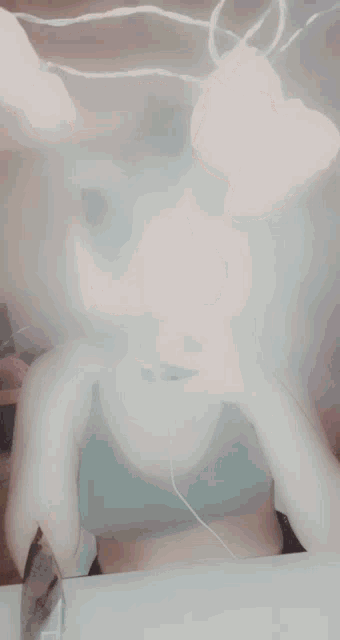 a woman taking a picture of herself in the mirror