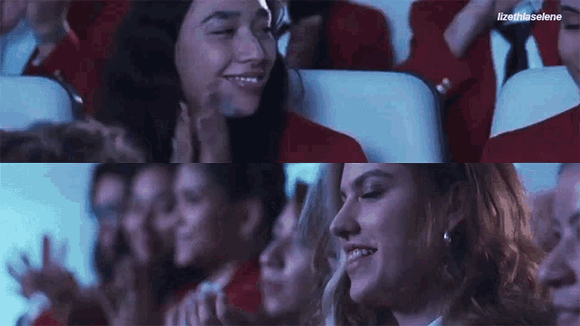 a group of people are sitting in a row and one of them is smiling