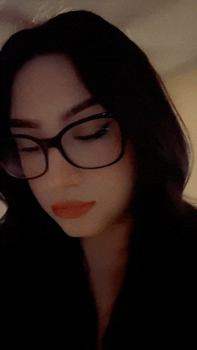 a close up of a woman 's face with red lips