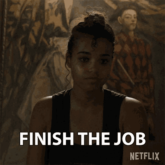 a woman says finish the job in front of a picture