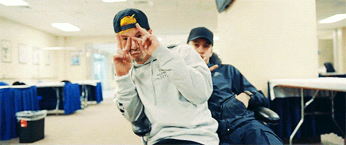 a man wearing a sweatshirt that says ' i 'm sorry i 'm sorry ' on it