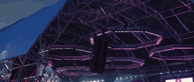 a stage with purple lights and a sign that says " distance "