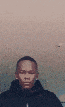 a man wearing a black hoodie with the word nike on it