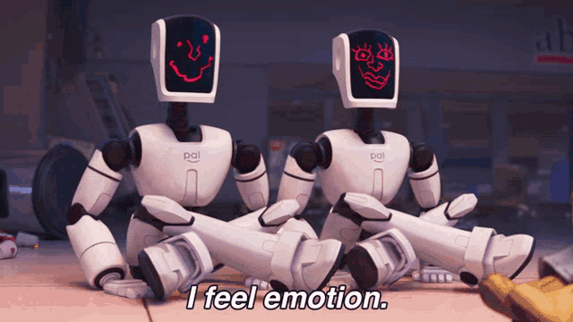 Robôs do filme "A Família Mitchell e a Revolta das Máquinas" desenhando expressões faciais em seus rostos de vidro dizendo "eu sinto emoção" em inglês.
