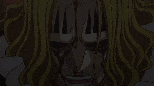 a close up of a man 's face with blood coming out of it