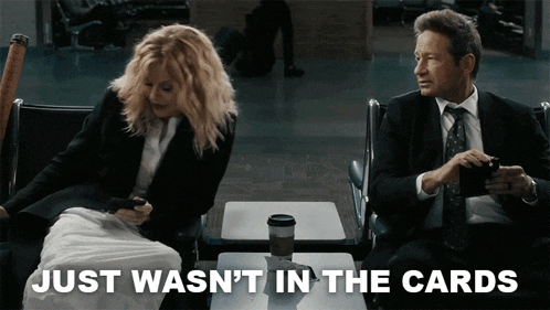 a man and a woman sitting next to each other with the words just wasn 't in the cards