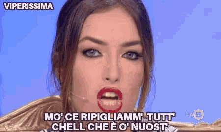 a close up of a woman 's face with the words viperissima written above her