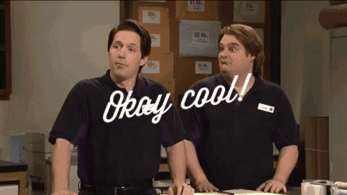 two men standing next to each other with the words " okay cool " on their shirts