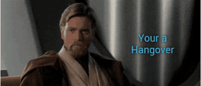 a man with a beard is sitting in front of a sign that says your a hangover