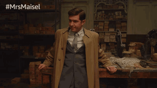a man in a trench coat says wait what in a warehouse