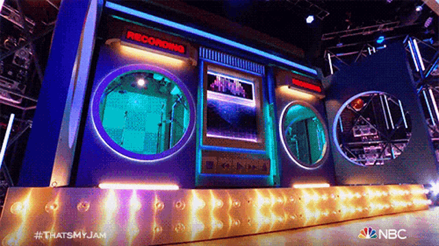 a stage with a sign that says recording in red