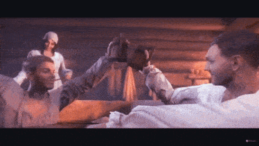 a group of men are toasting each other in a game