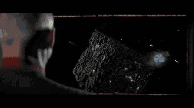 a red laser is being used to destroy a giant monster