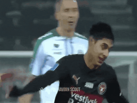 a soccer player wearing a black shirt that says vestivsk on it