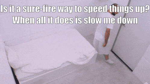 a man in a white shirt is standing in front of a bed with the words is it a sure fire way to speed things up ?