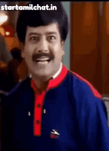 a man with a mustache is wearing a blue and red shirt with the words starttamilchat.in below him