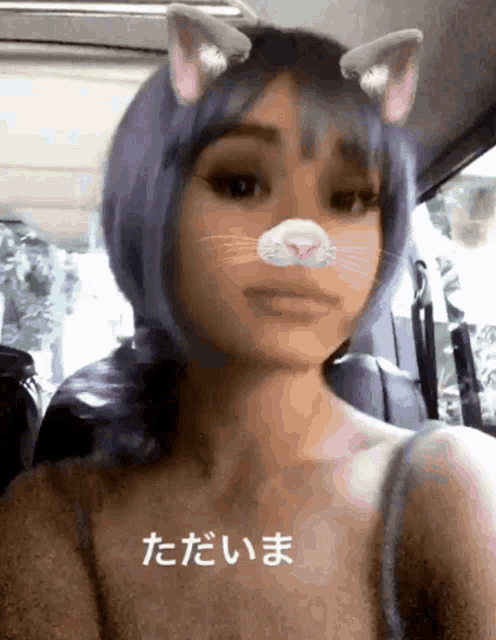 a woman with purple hair and cat ears is wearing a cat face filter
