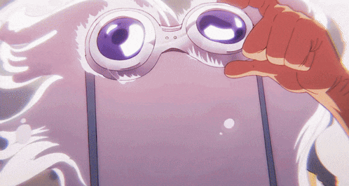 a close up of a person holding a cell phone with a pair of goggles on their face