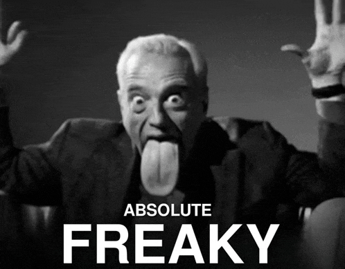 a black and white photo of a man sticking out his tongue with the words absolute freaky below him