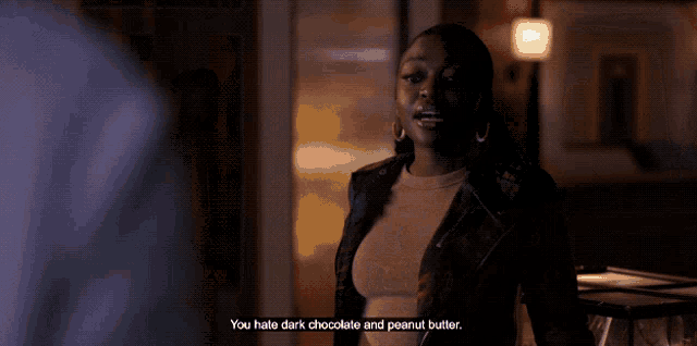 a woman says " you hate dark chocolate and peanut butter " in a dark room